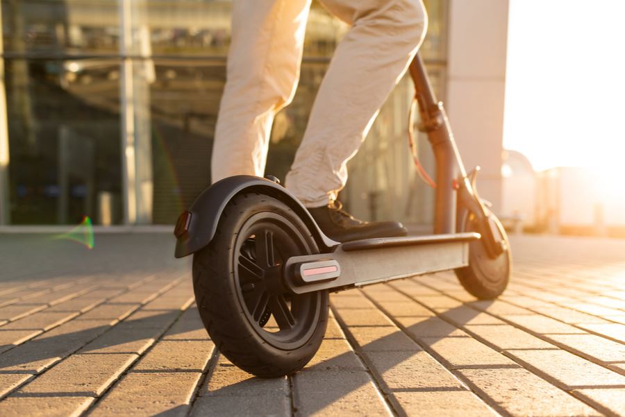 riding an electric scooter in a Florida city